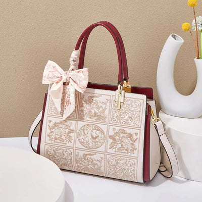 sylvia™ – unik crossbody med broderi og sløjfedetalje