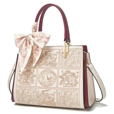 sylvia™ – unik crossbody med broderi og sløjfedetalje